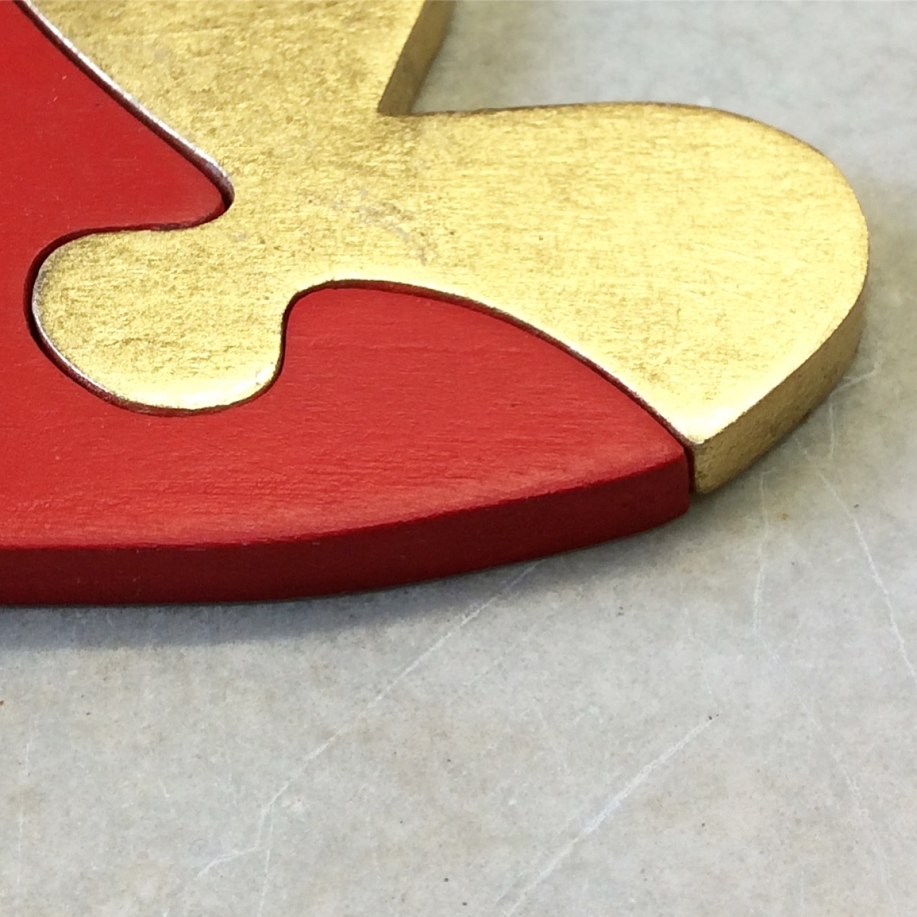 Red and gold heart puzzle Jane Harman storage and furniture restoration in Florence